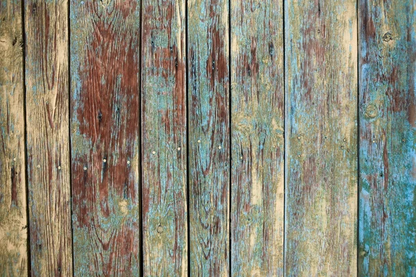 Старий пухнастий дерев'яний фон з тріщинами і шарами фарби — стокове фото