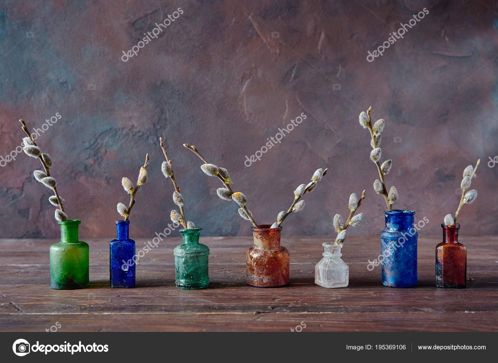 Vintage Colored Glass Bottles With Flowering Willow Branches On