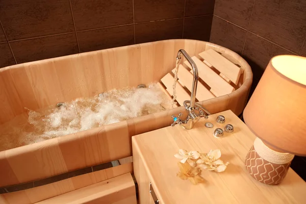 Hydro massage in a wooden bath, for relaxation and relaxation in the Spa.