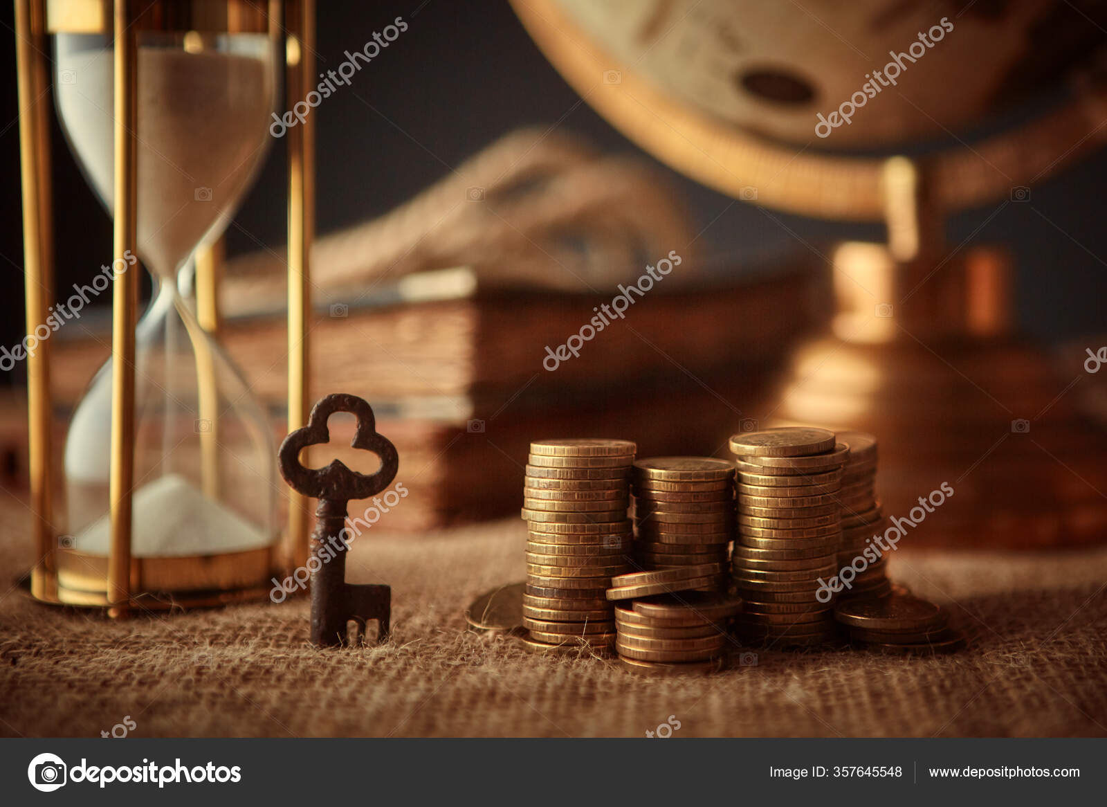 Coin collection with a magnifying glass hi-res stock photography
