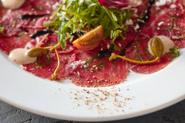 Marbled beef carpaccio. Top view, flat lay.