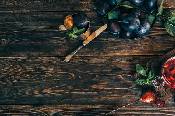 Chutney sauce made from red plum and apples. Indian cuisine. Additive to meat, rice and other dishes. Organic, healthy fruits.Toned image. Top view. Copy space.