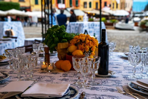 Elegant table decoration with wine glasses, forks, ornaments, ready to serve in event, wedding, celebration. Luxury wedding table.