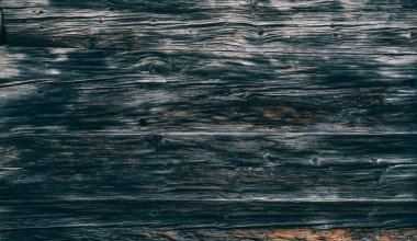 Eski doğal desenli koyu ahşap arkaplan yüzeyi.