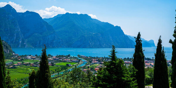 Summer in paradise Lago di Garda. Lake Garda and Sarca river near Torbole town, Northern Italy, Trentino-Alto Adige, Italy.