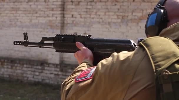 Ukraine Kyiv April 2016 Man Headphones Takes Aim Shoots Kalashnikov — Stock Video