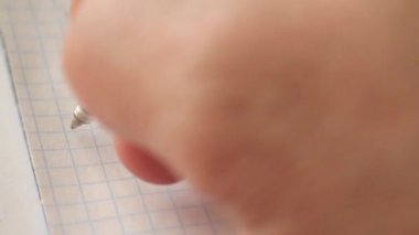 a male hand writes with a pen in a notebook: I'm happy :) .. Extreme close-up, Full HD,