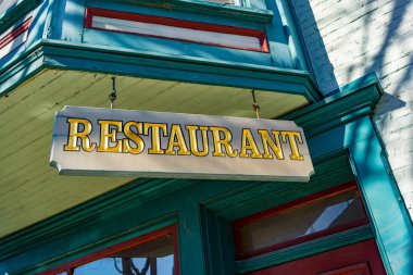 Hummelstown, PA / USA - February 23, 2020: A hanging Restaurant sign in the downtown area of Hummelstown.
