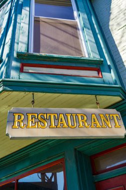 Hummelstown, PA / USA - February 23, 2020: A hanging Restaurant sign in the downtown area of Hummelstown.