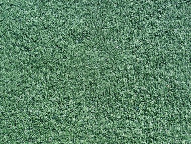 Dekoratif yeşil çim kredi doku. Spor ve boş zaman etkinlikleri. 