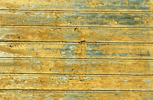 Parede de casa de madeira desgastada laranja — Fotografia de Stock