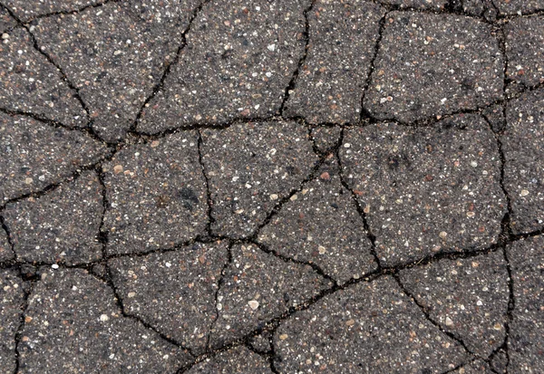 Gebarsten asfalt oppervlak. — Stockfoto