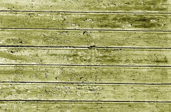 Yellow weathered wood house wall