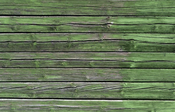 Weathered green color log house wall. — Stock Photo, Image