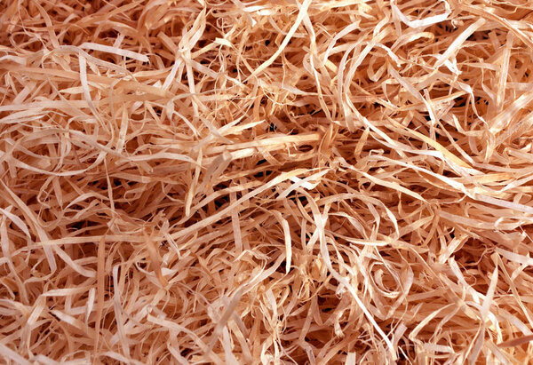 red toned wood shavings texture.