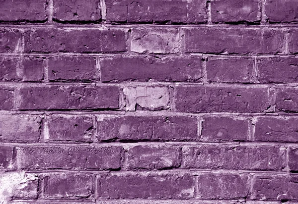Погодні текстури стіни з пурпурової цегли . — стокове фото