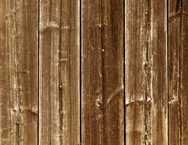 Texture de clôture en bois orange altérée avec des clous . — Photo