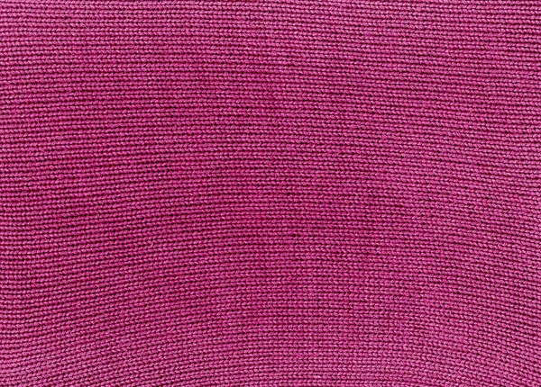 Roze gebreid materiaal textuur. — Stockfoto