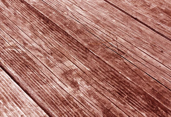 Superfície vermelha de madeira com arranhões e efeito borrão — Fotografia de Stock