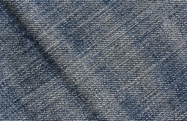 Синій колір джинсової тканини візерунок . — стокове фото