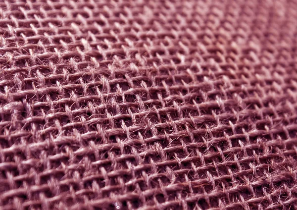 Couleur rose tissu hessian sac texture avec effet flou . — Photo