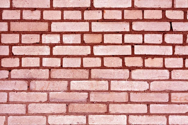 Red color grungy brick wall pattern. — Stock Photo, Image