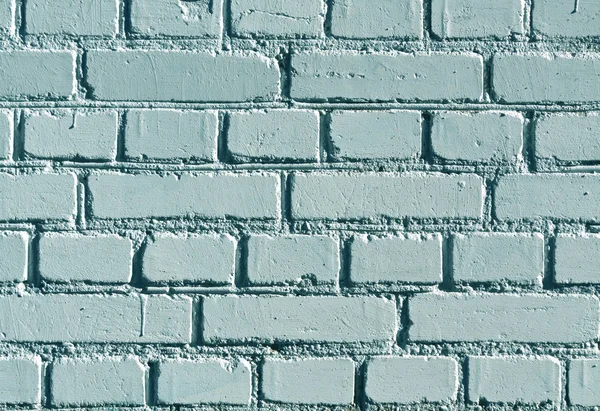 Weathered cyan color brick wall pattern.