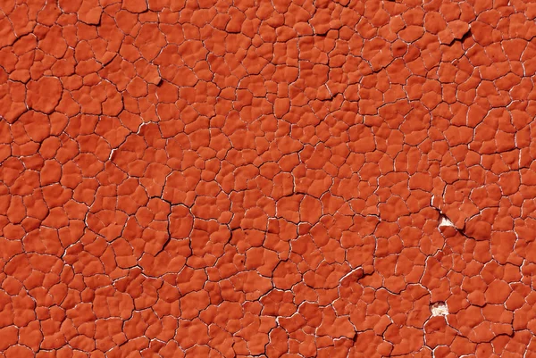 赤い色のひびの入った石膏壁パターン. — ストック写真