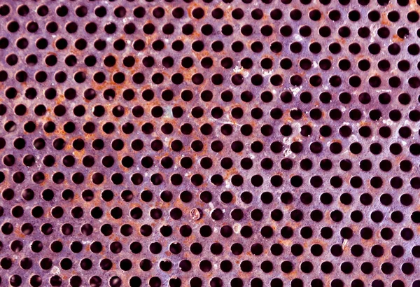 Purple color perforated metal floor pattern.