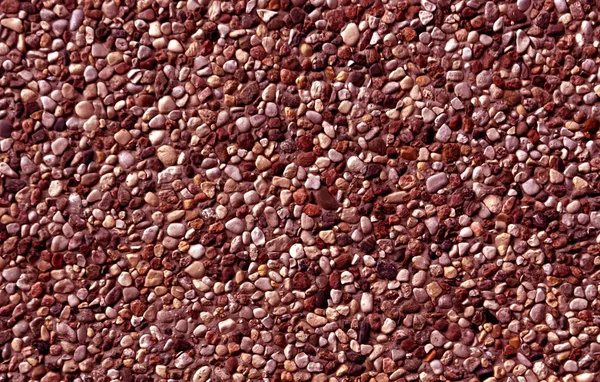 Color rojo patrón de piedras pequeñas . —  Fotos de Stock