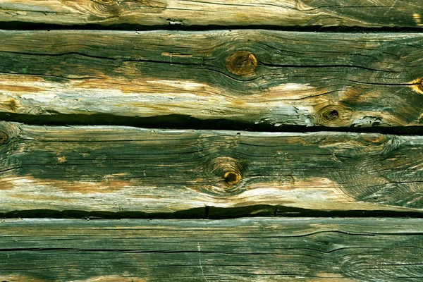 Zöld tónusú log ház falán. — Stock Fotó