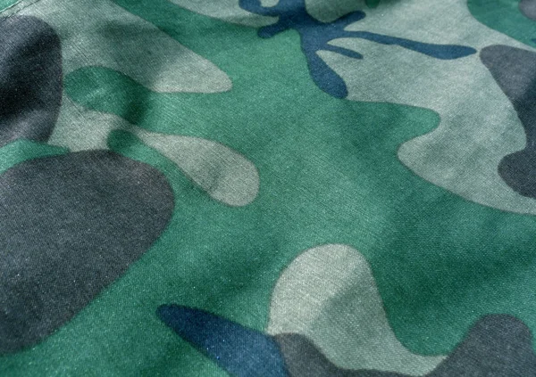 Kamouflage textil enhetliga närbild med oskärpa effekt. — Stockfoto