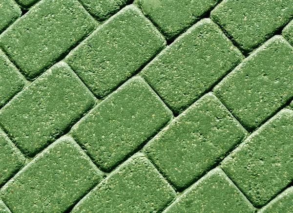 Zielony kolor powierzchni ułożonej kostki brukowej. — Zdjęcie stockowe