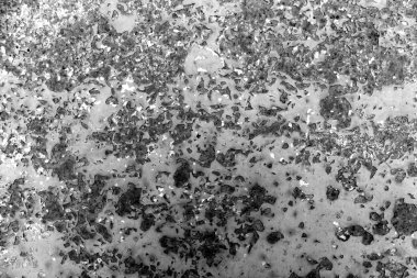 Siyah ve beyaz paslı metal yüzeylere tonda.