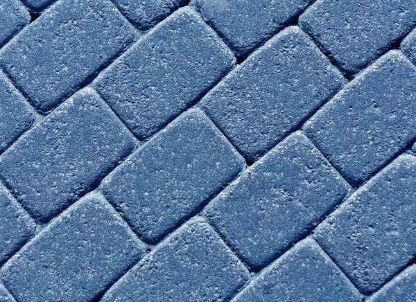 Blue color cobblestone pavement surface.