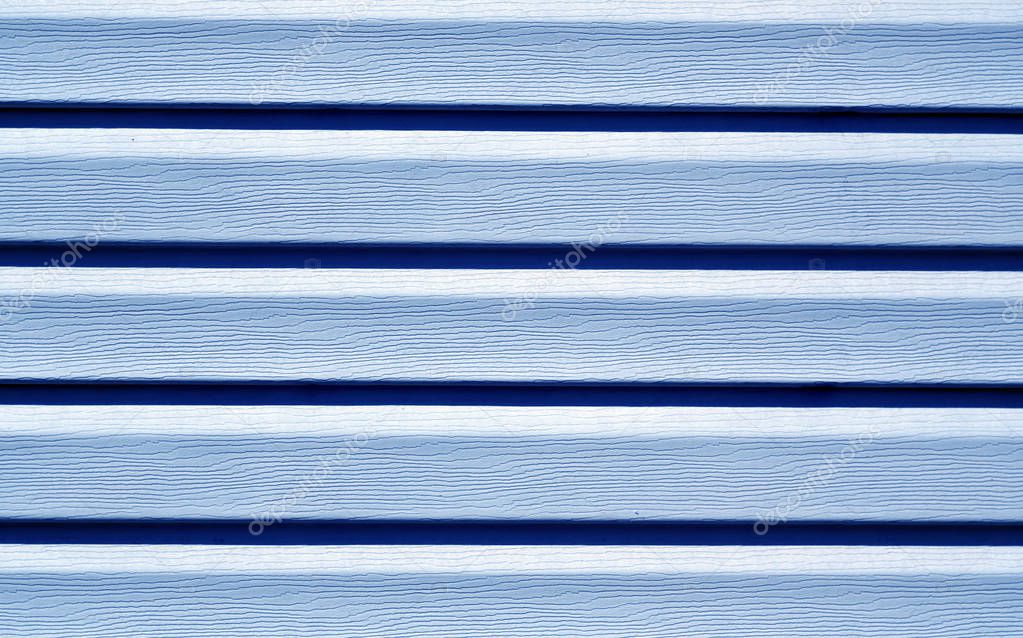 Blue color plastic panel wall pattern.