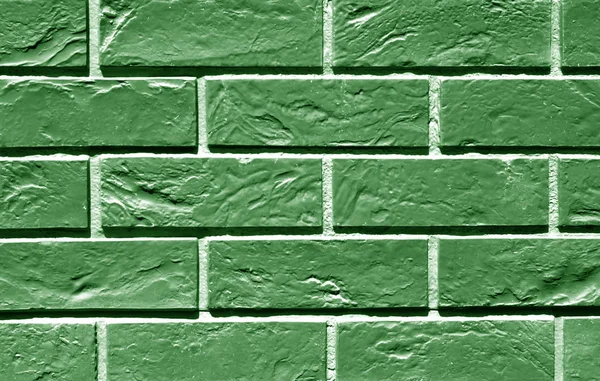 Green color brick wall texture.