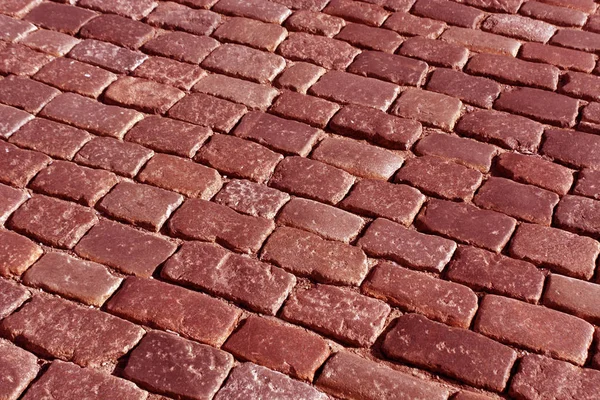 赤いトーンの古い石造りの舗装パターン. — ストック写真
