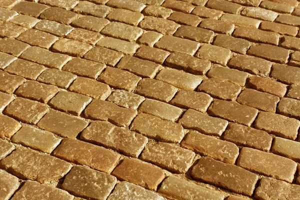 Velho padrão de pavimento de pedra em tom laranja . — Fotografia de Stock