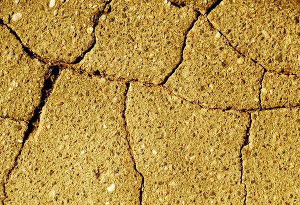 Textura de asfalto tonificada naranja dañada — Foto de Stock