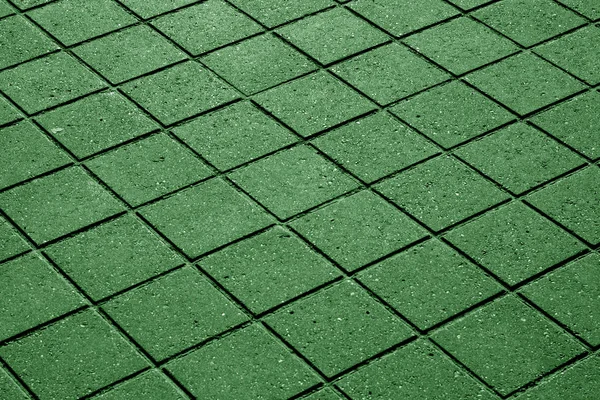 Green pavement surface.