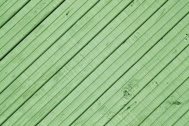 Ahşap duvar yüzeyi yeşil tonlu.