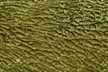 Sarı renk kırık cam yüzey. 