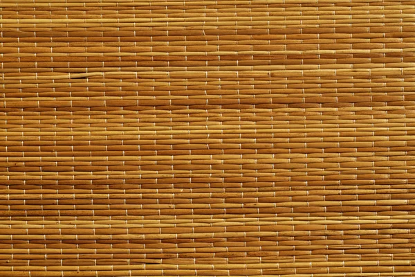 Orange color straw mat surface. — Stock Photo, Image