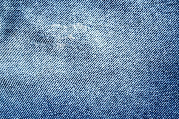 Velha textura jeans azul com arranhões . — Fotografia de Stock