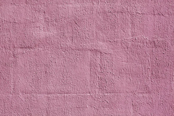 Pink color plaster wall pattern.