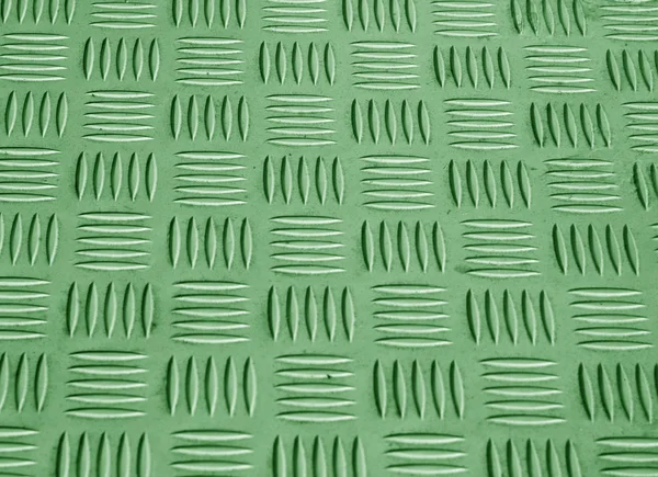 Green color metal floor pattern with blur effect.