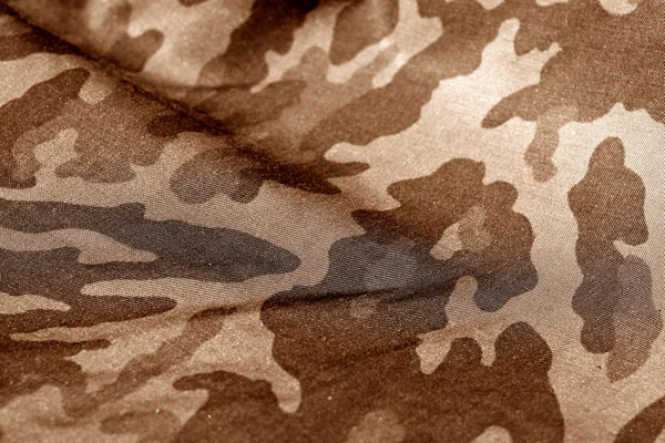 Military uniform pattern with blur effect in brown tone. — Stock Image Military uniform pattern with blur effect in brown tone. Stock Image