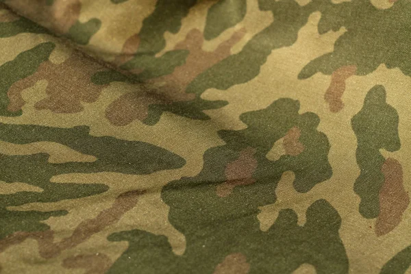 Military uniform pattern with blur effect. — Stock Photo, Image