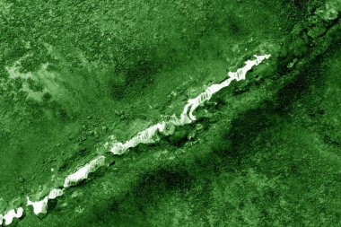 Yeşil tonda paslı metal kaynak.